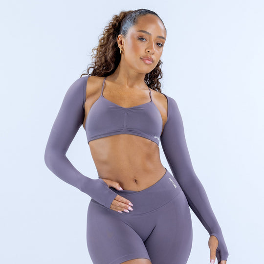 Women’s long-sleeve athletic shrug in mauve purple, cropped fit over sports bra