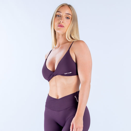 Dark purple twist-front sports bra with thin adjustable straps